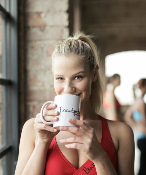 Smiling woman after a yoga session feeling refreshed and well.