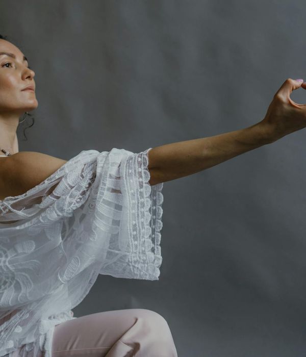Woman in a graceful yoga pose representing inner harmony.